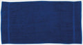 The Towel City TC004, a dark blue towel, is spread out flat, showcasing its rectangular shape and minimalist design.