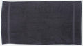 Introducing Towel City's TC004, a dark gray bath towel with a simple yet elegant design. It features two subtle vertical lines near the edges, and its soft, plush texture fills the entire frame.