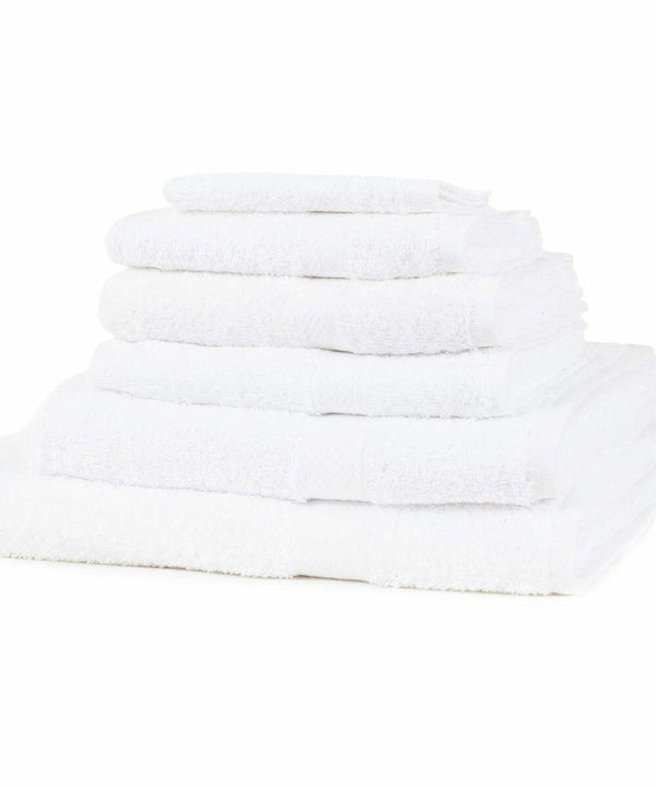A stack of Towel City TC005 white towels of varying sizes neatly folded on a flat surface.