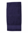 A Towel City TC034 towel in dark blue laid flat on a plain background.