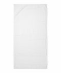 The TC034 from Towel City, a plain white bath towel, is laid flat on a surface, showcasing its full rectangular shape.