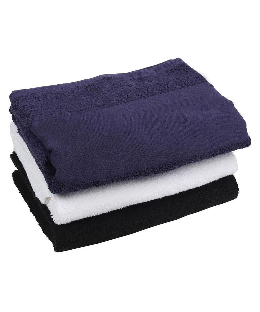 Three printable border bath towels by Towel City stacked on a white background: navy blue on top, white in the middle, and black at the bottom.