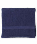 A folded navy blue TC044 by Towel City with a textured, absorbent surface.