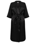 TC054 by Towel City is a black, silky robe featuring a waist belt, showcased against a plain background.