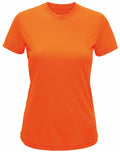 A bright orange Tri-Dri TR020 short-sleeve T-shirt is displayed against a white background. The T-shirt features a classic crew neck and a simple design, devoid of any visible logos or patterns. The fabric looks smooth and lightweight.
