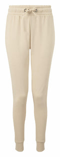 Tri-Dri's TR055 jogger pants in beige come with an elastic waistband, drawstring, and ribbed cuffs at the ankles, showcased against a plain white background.