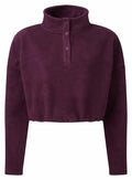 Tri-Dri's TR087 is a purple pullover featuring a high collar, button-up neckline, and long sleeves.