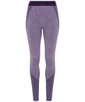 A pair of Tri-Dri TR212 seamless leggings in purple, featuring a high waist and textured paneling along the sides and lower legs, displayed against a white background.