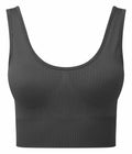 The TR213 from Tri-Dri is a dark gray, ribbed crop top featuring a sleeveless design and a scoop neckline.