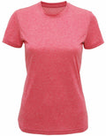 The Tri-Dri TR502 women's T-shirt, featuring a plain red design, is showcased on a white background. It has short sleeves and a round neckline, with a slightly fitted shape.