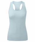 The TR509 by Tri-Dri is a women's athletic tank top in light blue featuring a racerback design. Made from smooth, fitted fabric, it is ideal for workouts or casual wear. The plain background accentuates the tank top's minimalist style.