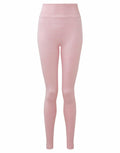 TR512 by Tri-Dri: Pink high-waisted leggings isolated on a white background. They feature a seamless design, are form-fitting, and made from a smooth fabric.