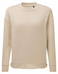 A long-sleeve TR600 sweatshirt from Tri-Dri, featuring a plain beige crew neck design, is displayed on a white background. The sweatshirt has a minimalist style with ribbed cuffs and hem.