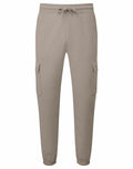 Tri-Dri's TR604 cargo jogger pants come in beige, featuring a drawstring waistband and elastic cuffs. They include two large flap-closure side pockets and are crafted from soft, comfortable fabric.
