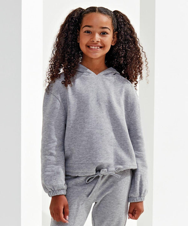 A young girl stands smiling, wearing a grey Tri-Dri TR85B hoodie and matching sweatpants. She has curly hair styled in two ponytails.