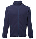 TS014 by 2786 is a navy blue fleece jacket featuring a full front zipper and two zippered side pockets.