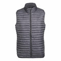 The TS019 by 2786 is a gray, quilted puffer vest featuring a high collar and front zipper. It offers a lightweight, padded design perfect for layering in cold weather.