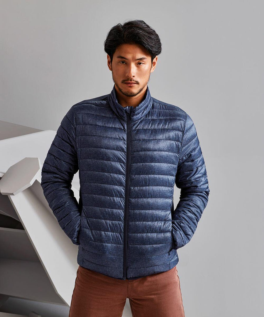 A man wearing a 2786 TS037 jacket and brown pants stands with his hands in his pockets against a neutral background.