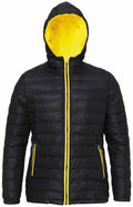 The TS16F jacket by 2786 features a black puffer design with a yellow interior and hood. The front zipper and pocket zippers also come in a vibrant yellow, and the jacket is showcased against a plain background.