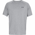 Under Armour's UA005 is a light gray short-sleeve athletic t-shirt, featuring a small black logo on the chest. It boasts a simple design with a crew neckline and seems to be crafted from breathable fabric.