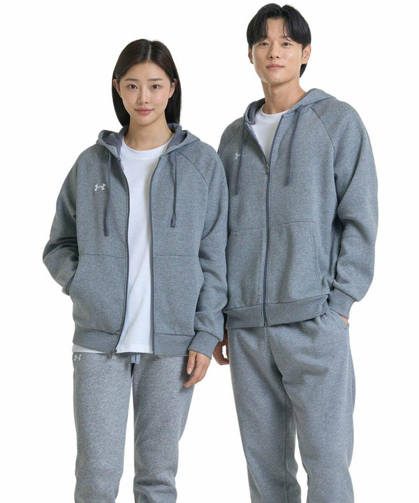Two people wearing matching gray Under Armour UA041 hoodies and sweatpants stand side by side, smiling at the camera. Both UA041 hoodies have zippers and drawstrings, and they are each wearing white shirts underneath.