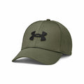 Under Armour's UA046 is a green baseball cap featuring a black emblem on the front, complete with a curved brim and visible seam lines.