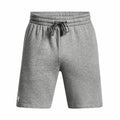 Under Armour's UA050 features gray athletic shorts designed with an elastic waistband and a drawstring, showcasing the logo on the left leg.