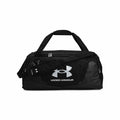 UA052 by Under Armour is a black duffel bag showcasing a prominent large logo on the front, equipped with both handles and an adjustable shoulder strap.