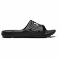 The UA054 by Under Armour is a black slide sandal featuring a textured footbed and a logo on the strap, depicted from the side view.