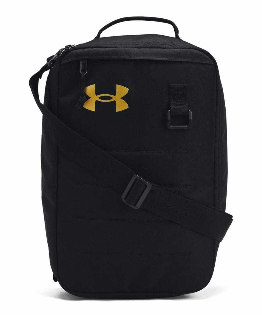 A black Under Armour UA058 shoulder bag with a gold logo, featuring a top handle, front zip, and an adjustable shoulder strap.