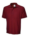 A Uneek UC102 adult unisex heavyweight polo shirt in Maroon