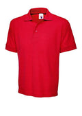 A Uneek UC104 adult unisex heavyweight cotton polo shirt in Red