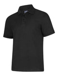 A Uneek UC108 adult unisex deluxe polo shirt in Black