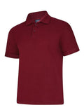 A Uneek UC108 adult unisex deluxe polo shirt in Maroon