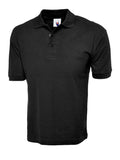 Black UC112 Cotton Rich Polo Shirt with a collar and three-button placket, displayed on a plain white background by Uneek.