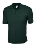 Dark green UC112 Cotton Rich Polo Shirt with short sleeves and a buttoned collar, displayed on a plain background by Uneek.