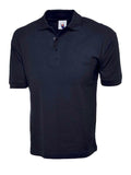 Navy Uneek UC112 Cotton Rich Polo Shirt displayed on a mannequin against a plain background, featuring short sleeves and a collar with buttons.