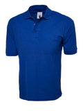 Blue UC112 Cotton Rich Polo Shirt from Uneek displayed on a mannequin with a visible logo on the collar.