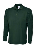 A Uneek UC113 adult unisex long sleeve classic polo shirt in Bottle Green