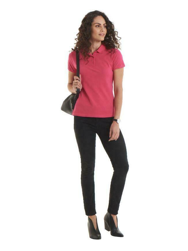 A woman wearing a UC115 Hot Pink  Uneek ladies ultra cotton polo shirt with Black trousers