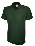 A Uneek UC116 Childrens active cotton polo shirt in Bottle Green on a white background