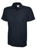A Uneek UC116 Childrens active cotton polo shirt in Navy on a white background