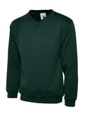 A Uneek UC204 adult unisex classic v-neck sweatshirt in Bottle Green