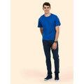 A man wearing a UC302 Roral Uneek heavyweight t-shirt with Blue jeans