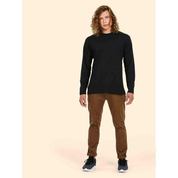A man wearing a UC314 Black Uneek L/S classic t-shirt with Brown trousers