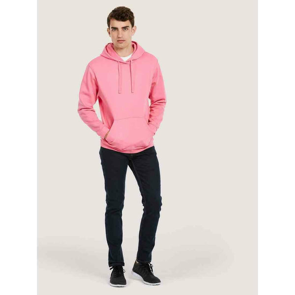 A man wearing a UC509 Pink Uneek deluxe hooded sweatshirt with Blue jeans