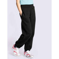 A girl wearing a UC521 Black Uneek childrens jog bottoms