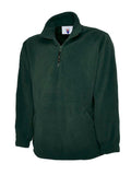 A Uneek UC602 adult unisex classic quarter-zip fleece jacket in Bottle Green