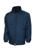 A Uneek UC605 adult unisex classic reversable fleece jacket in Navy