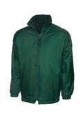 A Uneek UC606 childrens unisex classic reversable fleece jacket in Bottle Green
